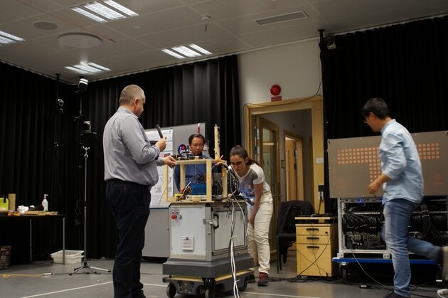 Researchers and robot in the Mocap studio