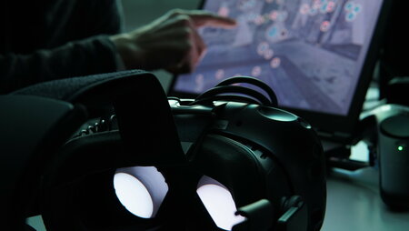 Virtual reality glasses in front of screen