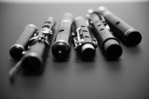 black and white picture with several flutes